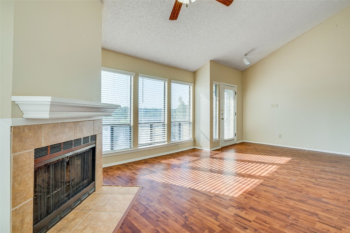 2612 San Pedro Street, Unit 222 Austin, TX 78705 - Photo 12 of 37 a view of an empty room with exposed radiator and fireplace