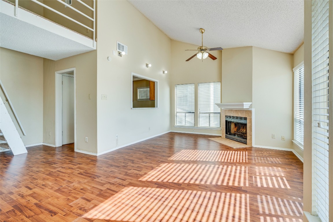2612 San Pedro Street, Unit 222 Austin, TX 78705 - Photo 16 of 37 a view of a livingroom with wooden floor and a ceiling fan