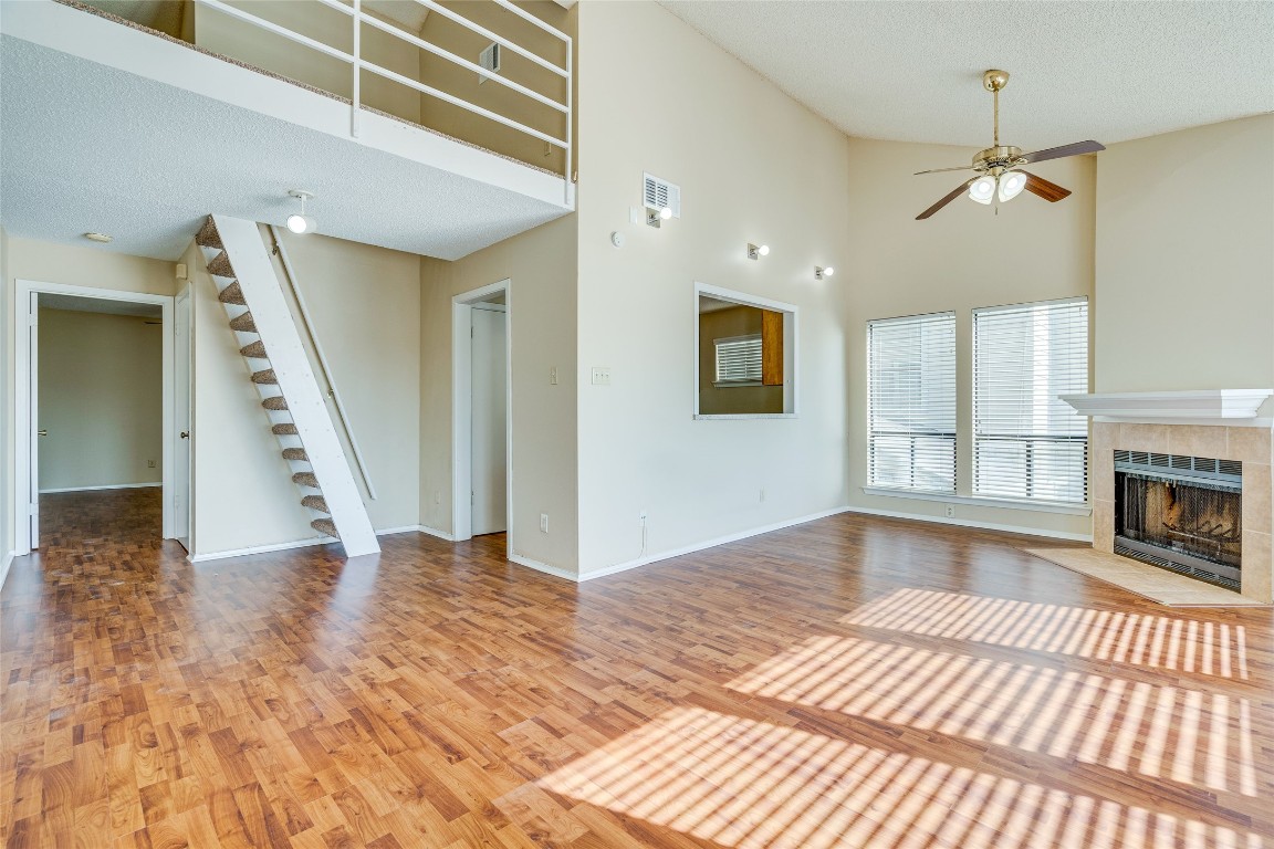 2612 San Pedro Street, Unit 222 Austin, TX 78705 - Photo 17 of 37 a view of an empty room with wooden floor fireplace and a window