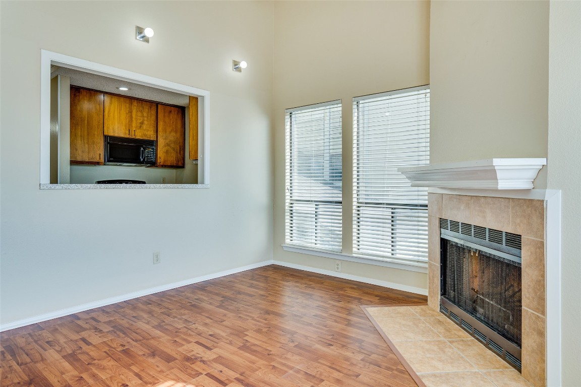 2612 San Pedro Street, Unit 222 Austin, TX 78705 - Photo 19 of 37 a view of an empty room with a fireplace and a window