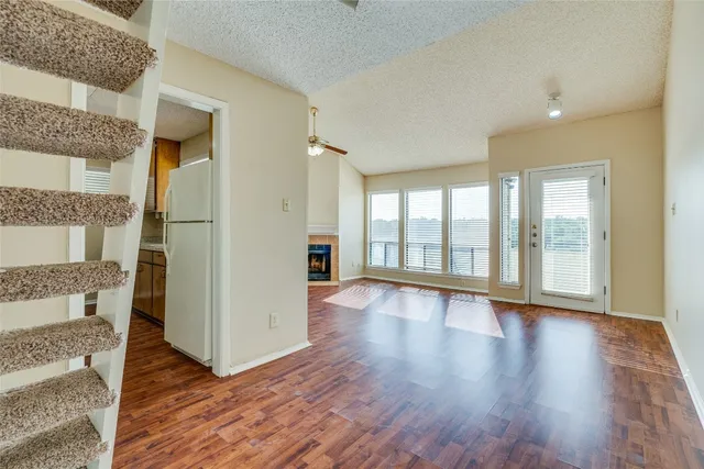 a kitchen with stainless steel appliances granite countertop a sink and a stove