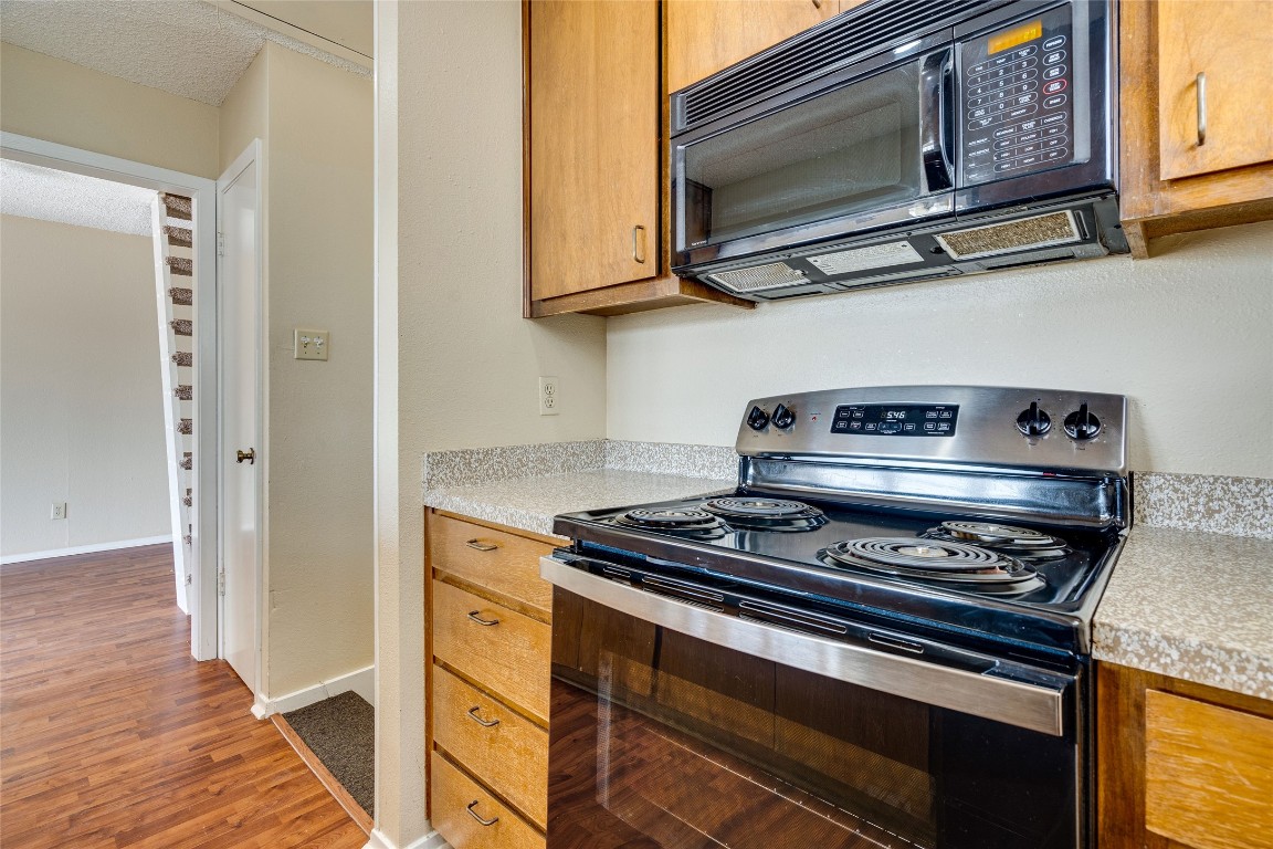 2612 San Pedro Street, Unit 222 Austin, TX 78705 - Photo 28 of 37 a kitchen with stainless steel appliances a stove and a microwave