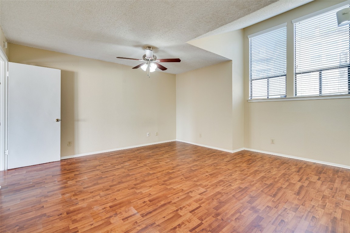 2612 San Pedro Street, Unit 222 Austin, TX 78705 - Photo 32 of 37 a view of empty room with wooden floor and fan