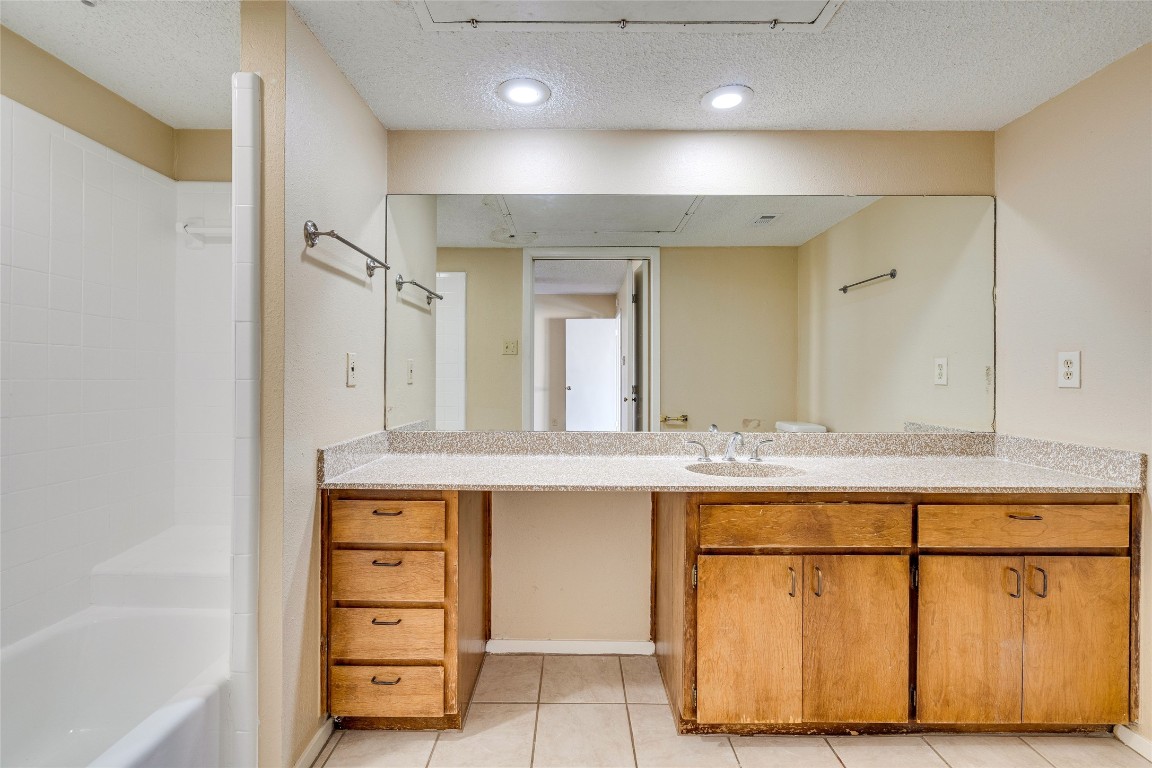 2612 San Pedro Street, Unit 222 Austin, TX 78705 - Photo 34 of 37 a bathroom with a sink double vanity and a tub