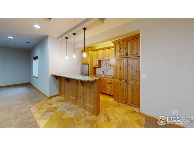 a bathroom with a sink mirror and shower