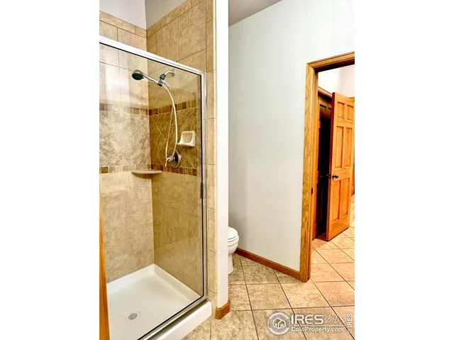 a bathroom with a glass shower door