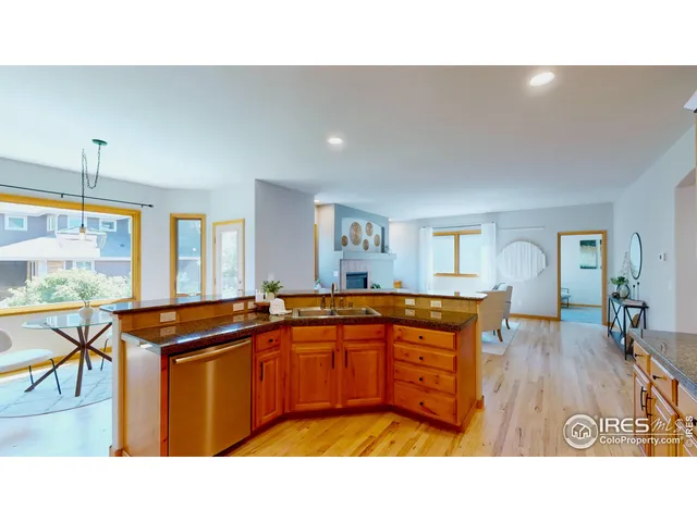 a kitchen with sink and view living room