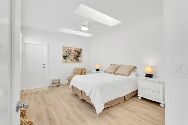 a bedroom with a bed and white walls