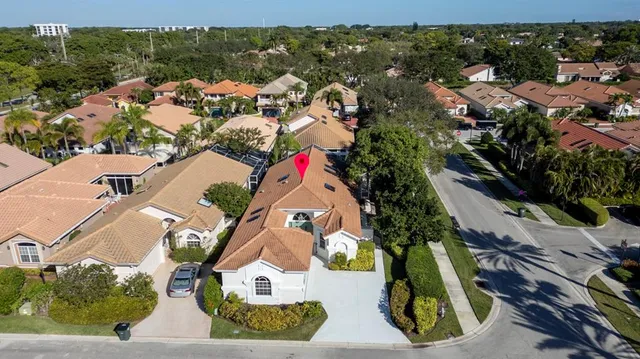 an aerial view of residential houses with outdoor space
