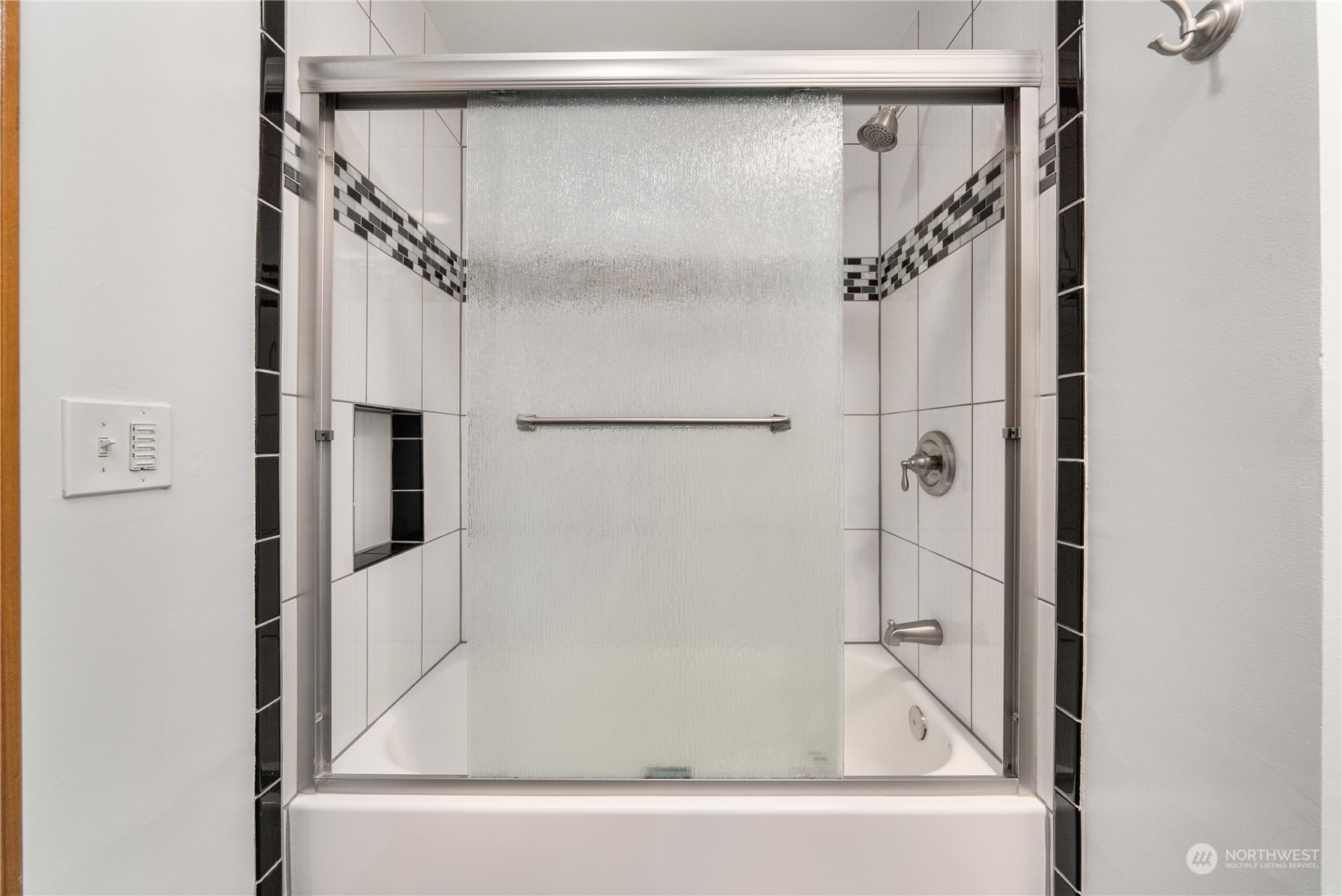 7211 Beverly Boulevard Everett, WA 98203 - Photo 17 of 36 a bathroom with a bathtub and a shower