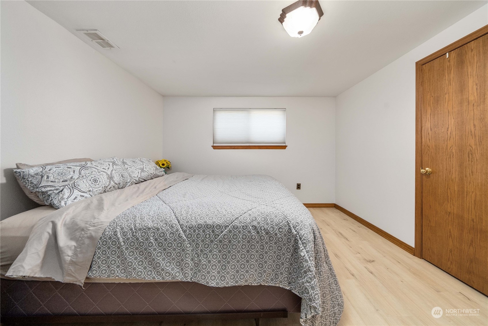 7211 Beverly Boulevard Everett, WA 98203 - Photo 18 of 36 a bedroom with a bed and window