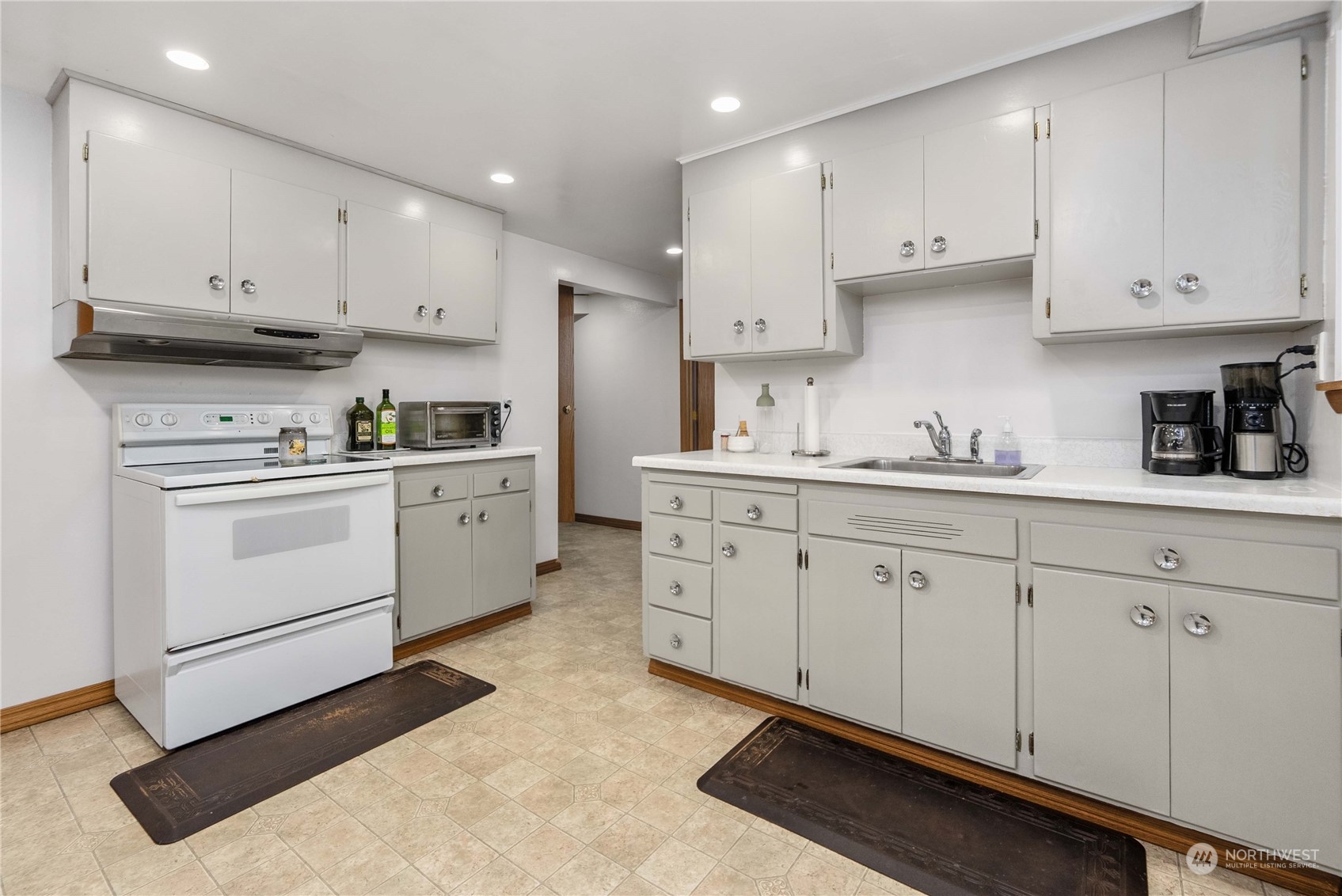 7211 Beverly Boulevard Everett, WA 98203 - Photo 20 of 36 a kitchen with cabinets stainless steel appliances and a sink