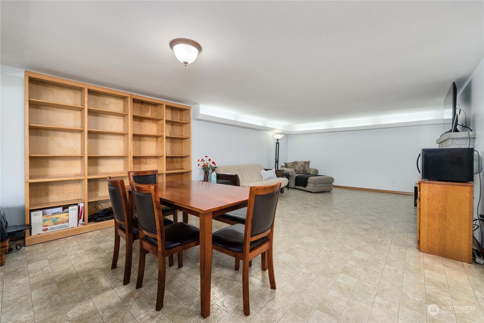 7211 Beverly Boulevard Everett, WA 98203 - Photo 22 of 36 a view of a dining room with furniture and a chandelier