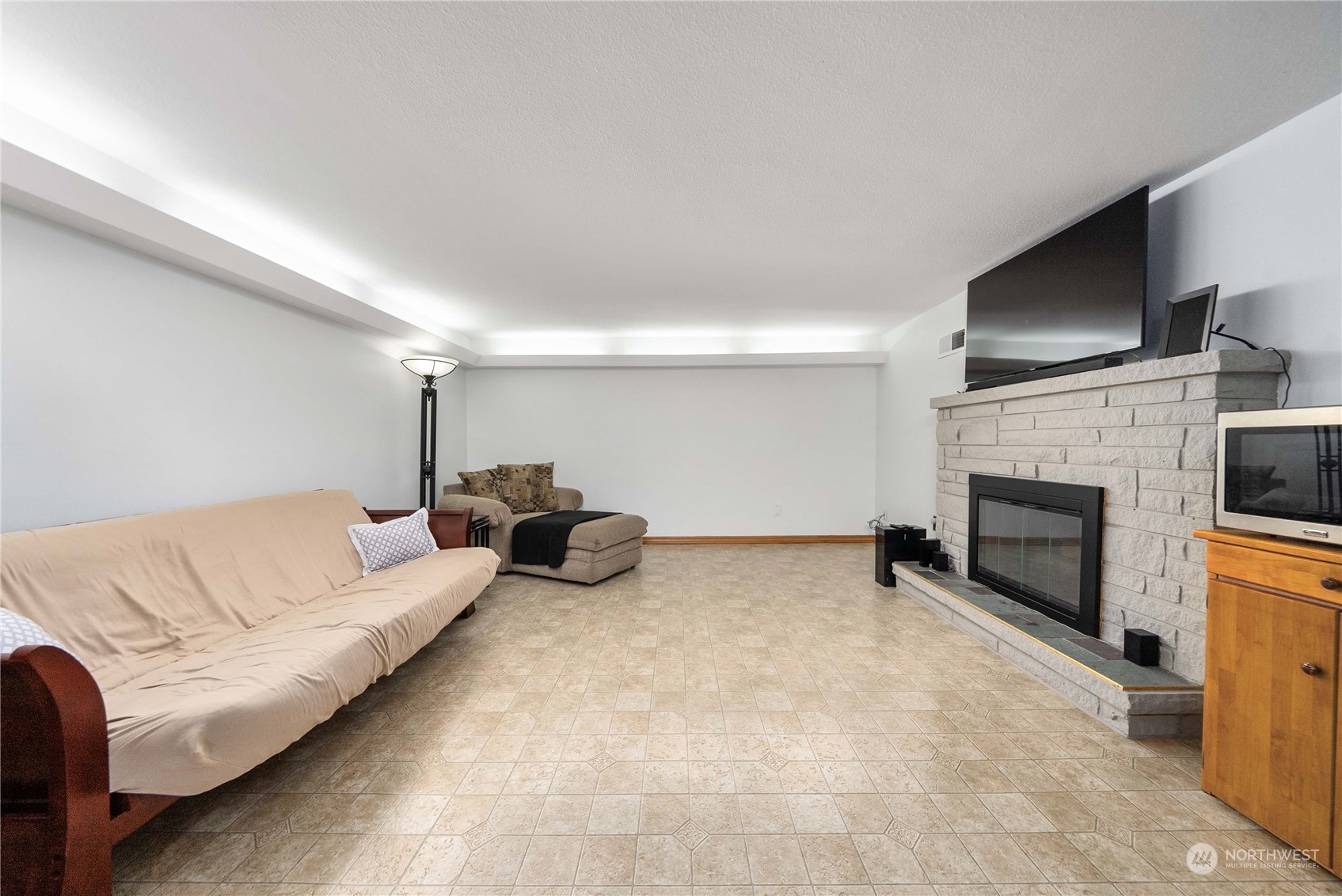 7211 Beverly Boulevard Everett, WA 98203 - Photo 23 of 36 a living room with furniture and a fireplace