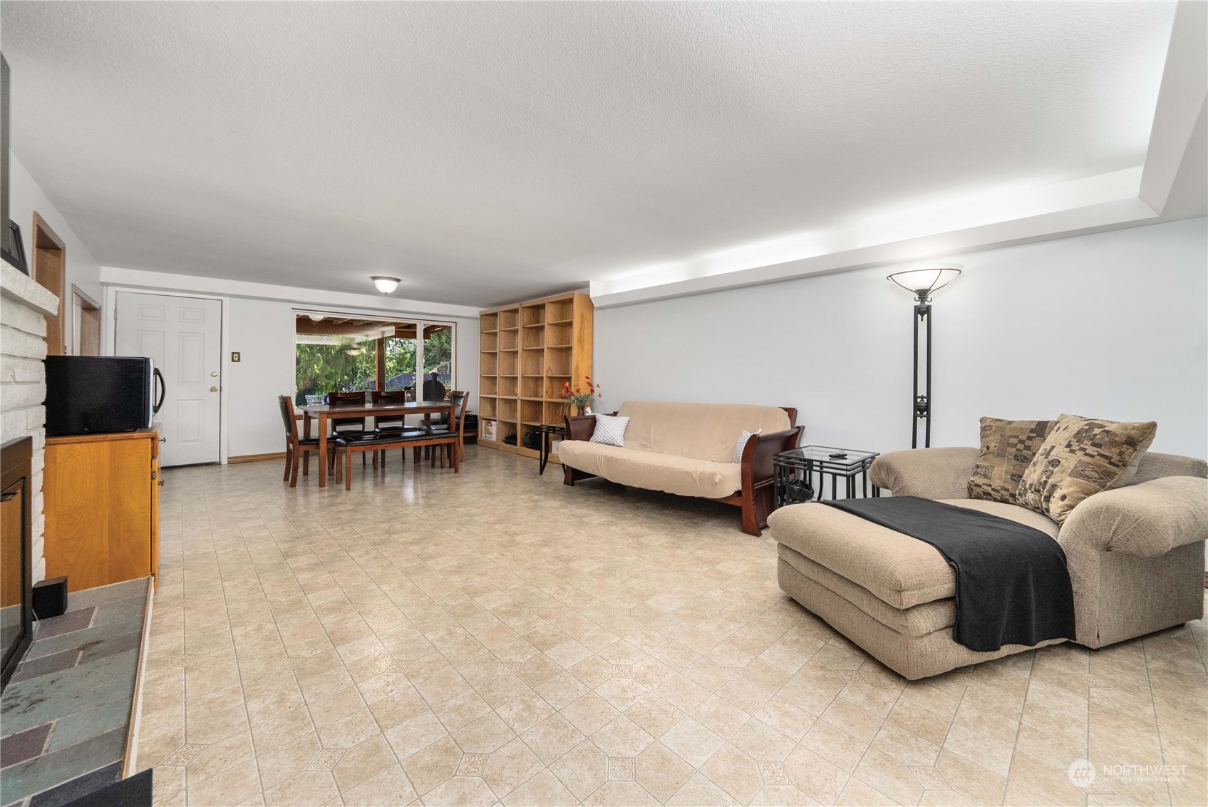 7211 Beverly Boulevard Everett, WA 98203 - Photo 24 of 36 a living room with furniture and a dining table with kitchen view