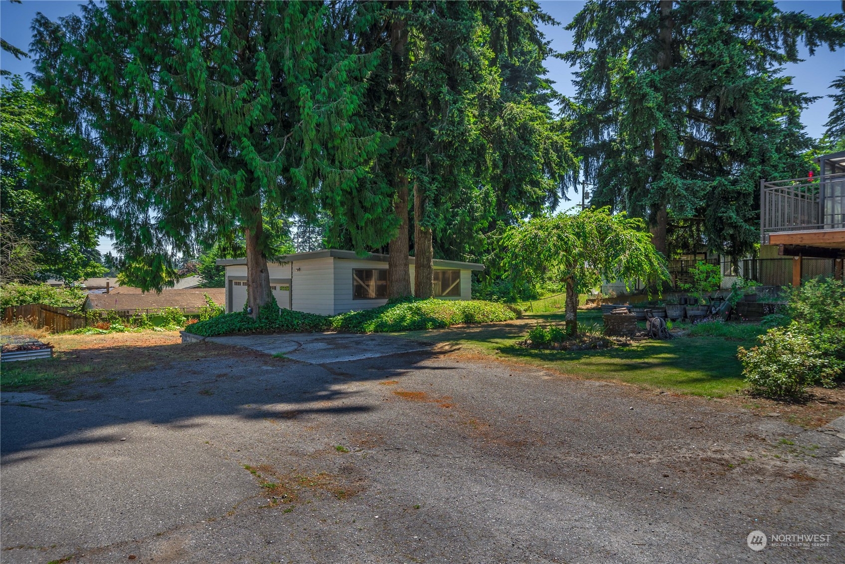 7211 Beverly Boulevard Everett, WA 98203 - Photo 32 of 36 a view of a house with a yard and tree s