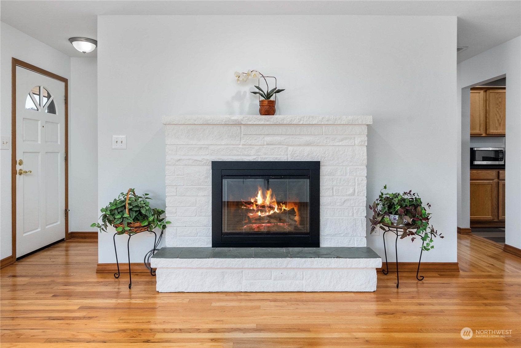 7211 Beverly Boulevard Everett, WA 98203 - Photo 6 of 36 a living room with furniture and a fireplace