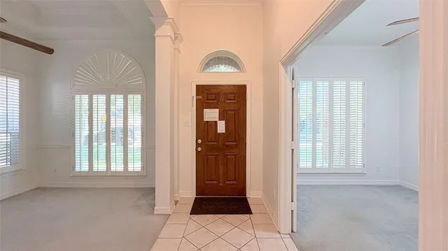 an empty room with windows closet and livingroom