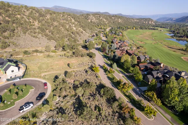 a view of a city with mountains in the background