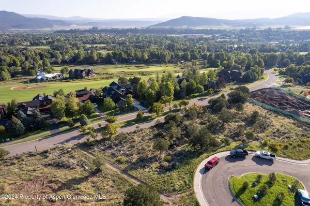 a view of a swimming pool with a table and chairs