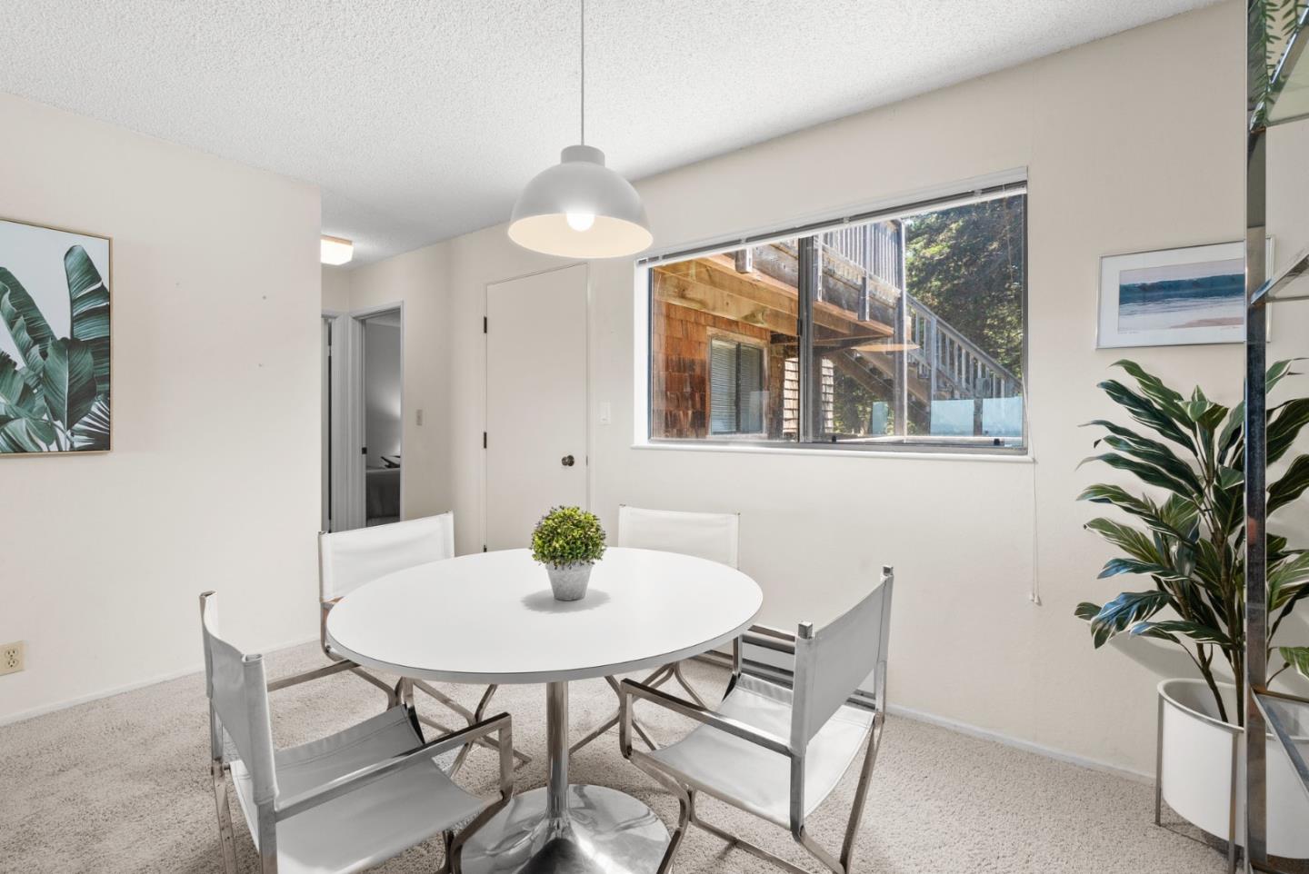 101 Shell Road, Unit 227 Watsonville, CA 95076 - Photo 12 of 29 a view of a dining room with furniture and a potted plant