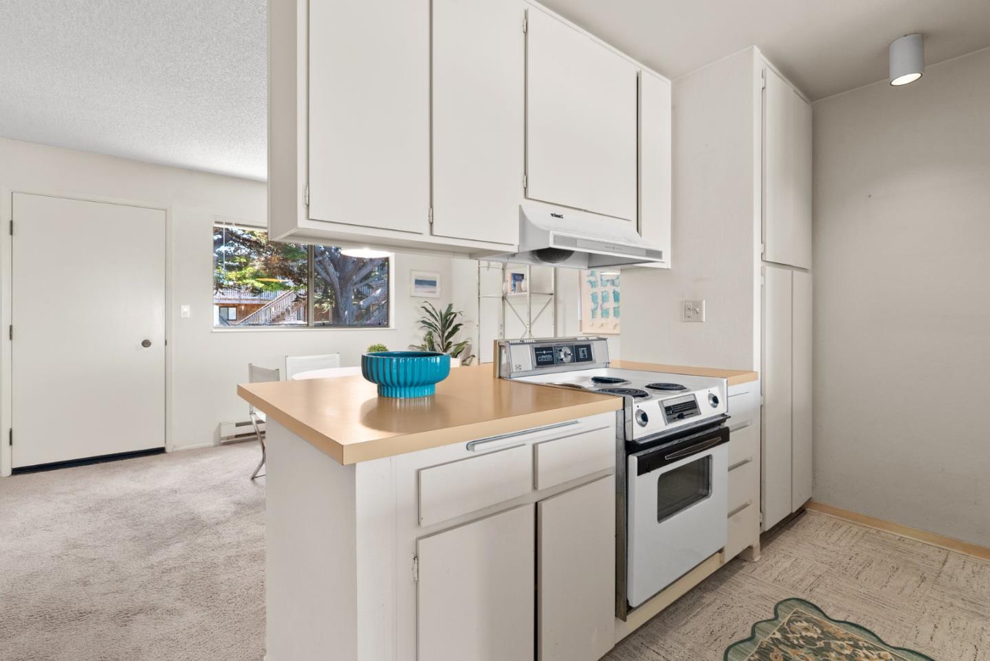 101 Shell Road, Unit 227 Watsonville, CA 95076 - Photo 16 of 29 a kitchen with white cabinets and white appliances