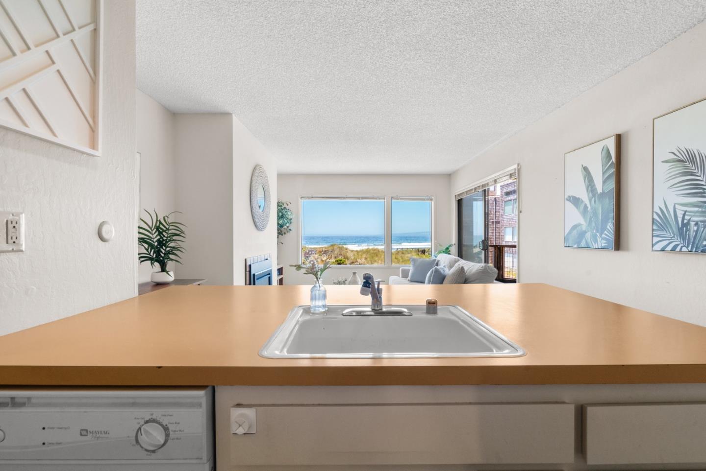 101 Shell Road, Unit 227 Watsonville, CA 95076 - Photo 19 of 29 a view of kitchen with kitchen island a stove and a potted plant