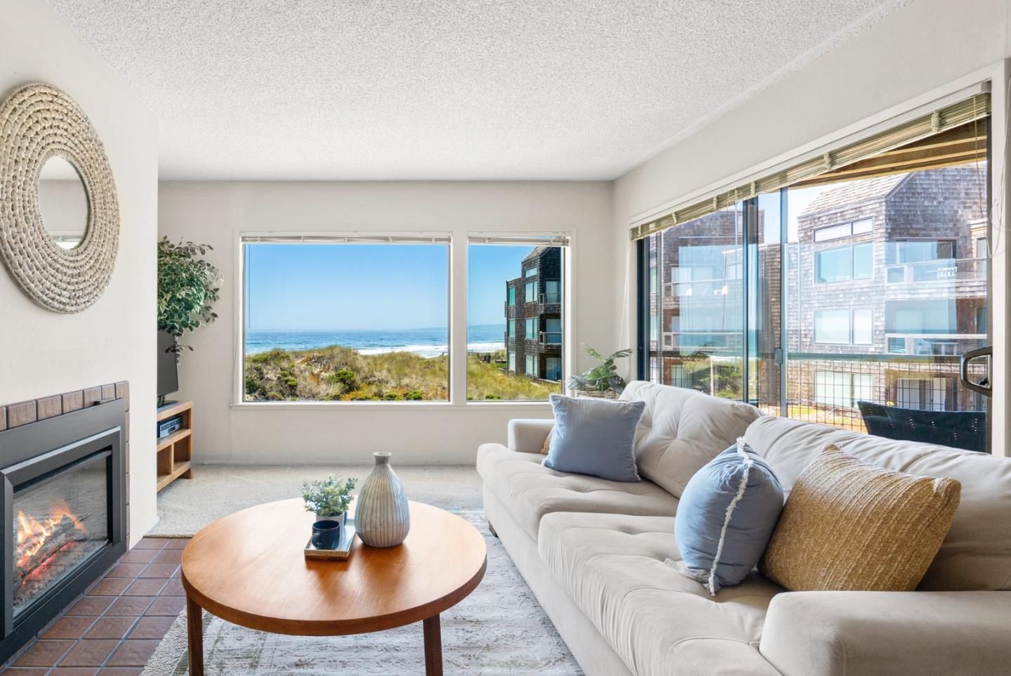 101 Shell Road, Unit 227 Watsonville, CA 95076 - Photo 2 of 29 a living room with furniture and a fireplace