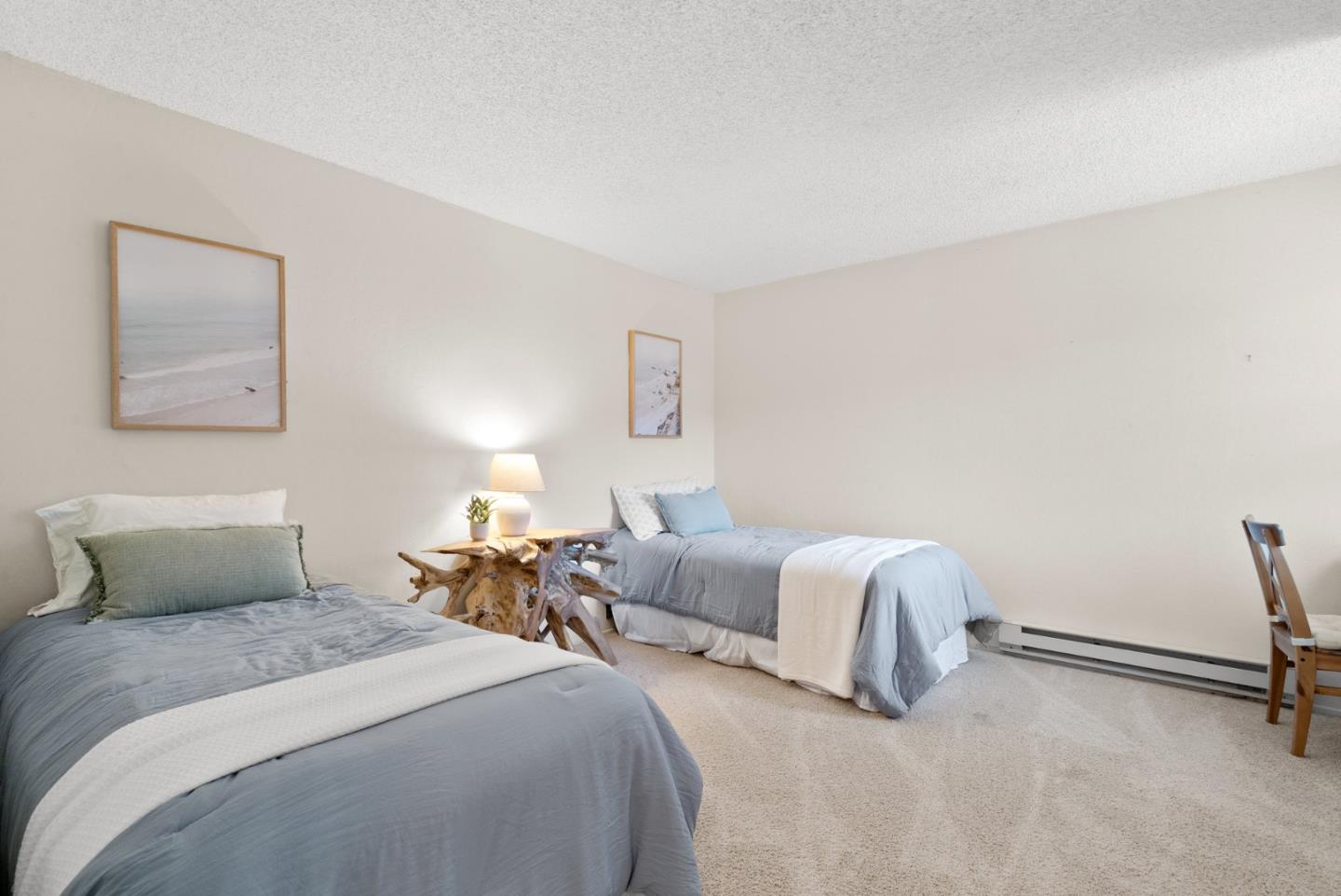 101 Shell Road, Unit 227 Watsonville, CA 95076 - Photo 21 of 29 a bedroom with a bed and a lamp