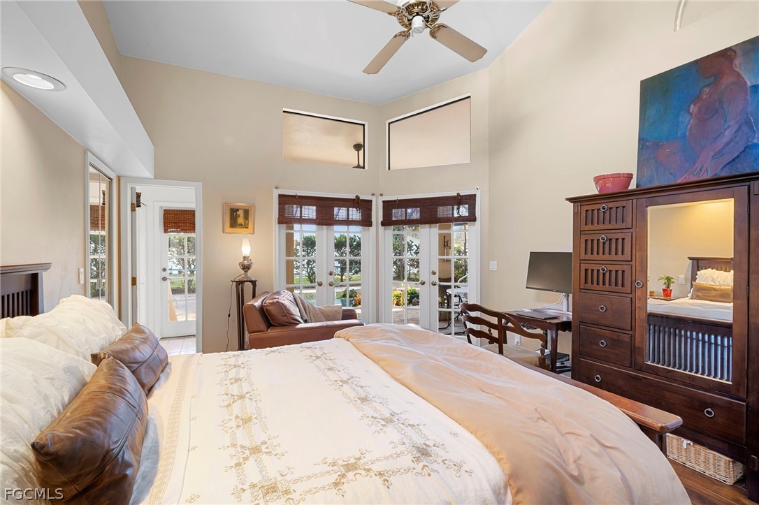 11772 Mahogany Run Fort Myers, FL 33913 - Photo 37 of 50 a bedroom with a bed and large windows