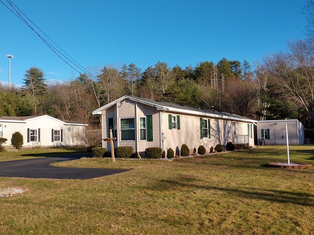 414 Palmer Road Ware, MA 01082 - Photo 1 of 16 a front view of a house with a yard