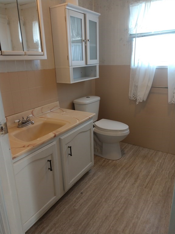 414 Palmer Road Ware, MA 01082 - Photo 11 of 16 a bathroom with a toilet sink and mirror