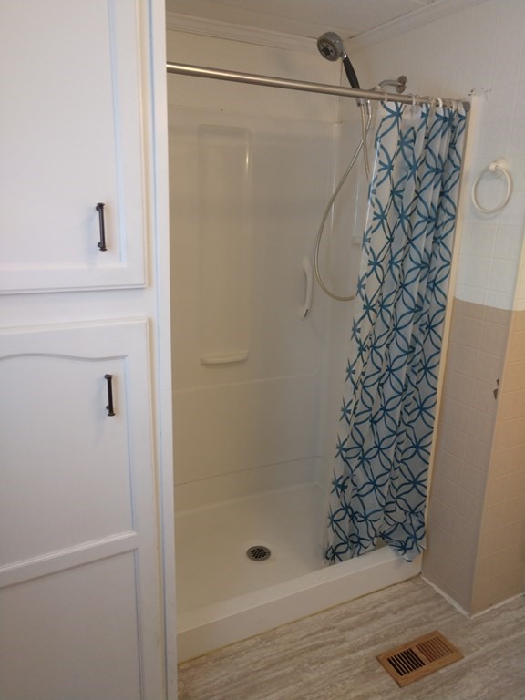414 Palmer Road Ware, MA 01082 - Photo 12 of 16 a bathroom with a glass shower door