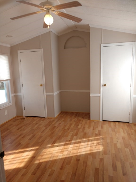414 Palmer Road Ware, MA 01082 - Photo 14 of 16 a view of an empty room with window and wooden floor