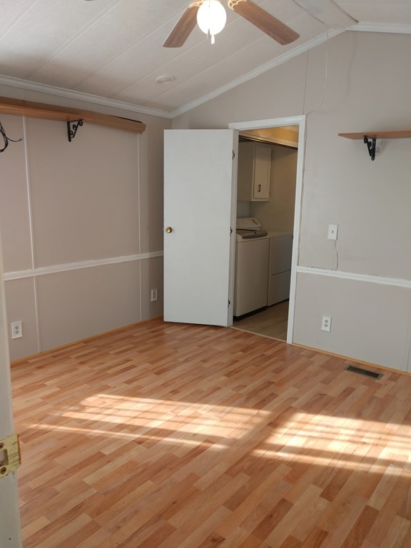 414 Palmer Road Ware, MA 01082 - Photo 15 of 16 a view of empty room with wooden floor and fan