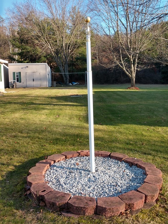 414 Palmer Road Ware, MA 01082 - Photo 3 of 16 a view of a patio with a yard