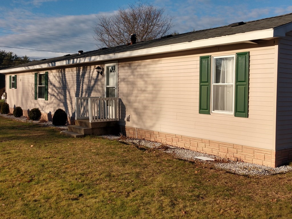 414 Palmer Road Ware, MA 01082 - Photo 4 of 16 a view of a house with a garden