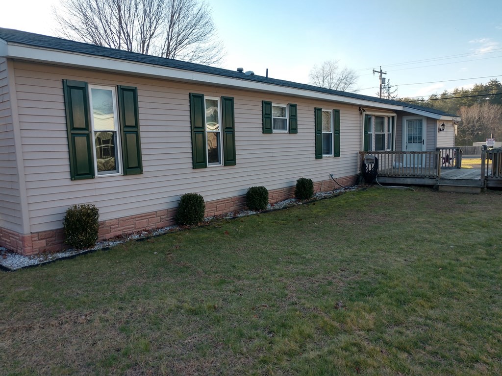414 Palmer Road Ware, MA 01082 - Photo 6 of 16 a view of a house with a backyard
