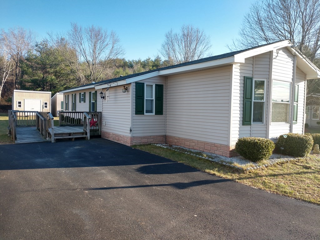 414 Palmer Road Ware, MA 01082 - Photo 7 of 16 a front view of a house with a yard