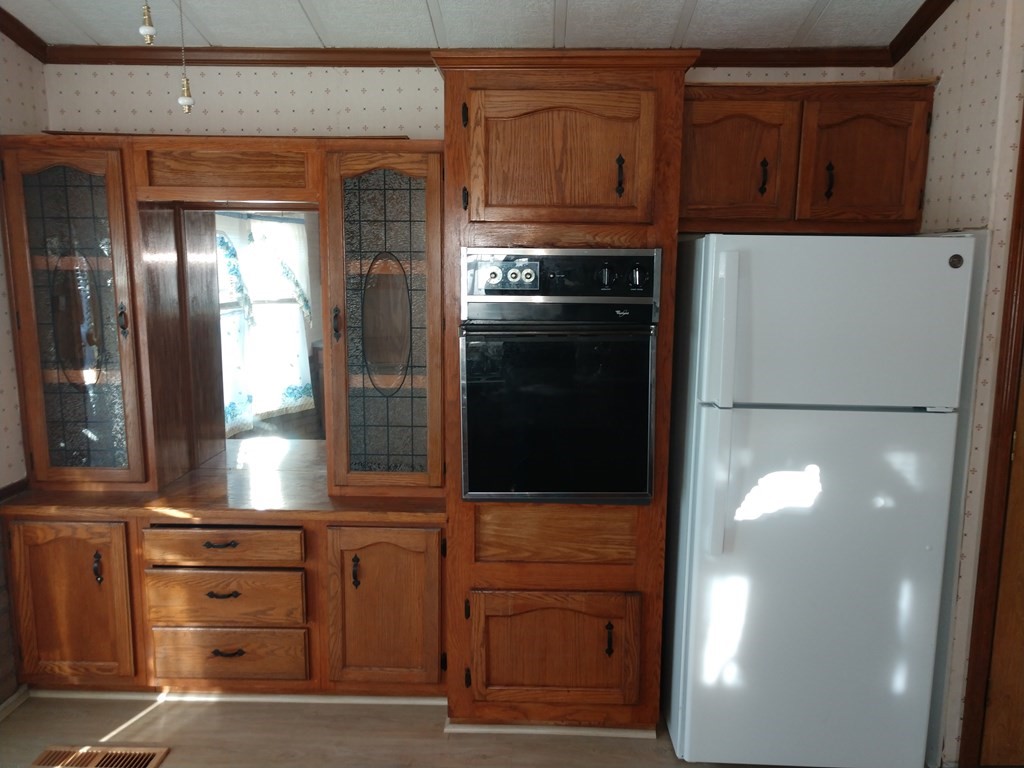 414 Palmer Road Ware, MA 01082 - Photo 10 of 16 a kitchen with stainless steel appliances granite countertop a refrigerator and a stove