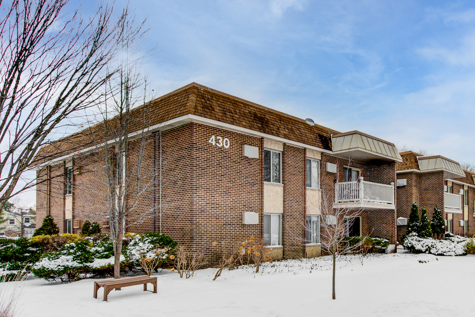 430 North Wilke Road, Unit 105 Palatine, IL 60074 - Photo 1 of 15 a front view of a building with street view