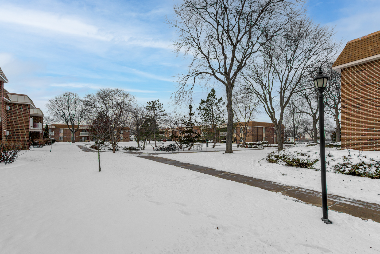 430 North Wilke Road, Unit 105 Palatine, IL 60074 - Photo 14 of 15 a street view with residential house