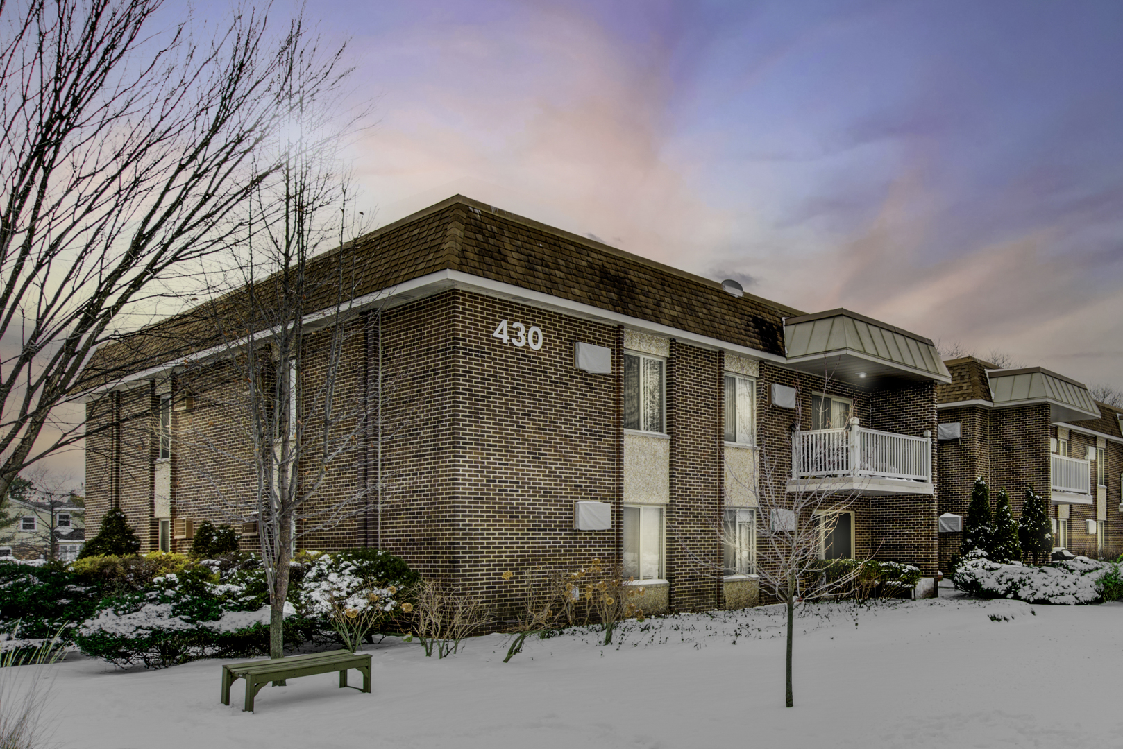 430 North Wilke Road, Unit 105 Palatine, IL 60074 - Photo 15 of 15 a front view of a building with parking area