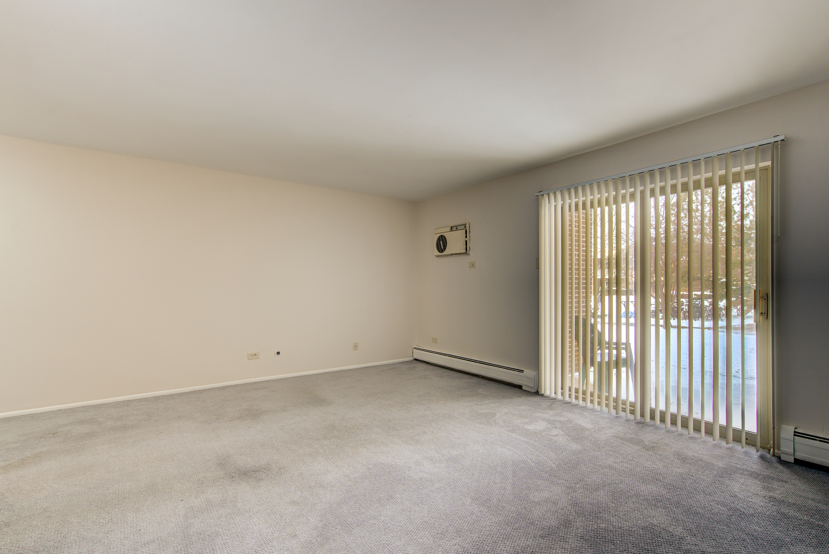 430 North Wilke Road, Unit 105 Palatine, IL 60074 - Photo 3 of 15 an empty room with a window