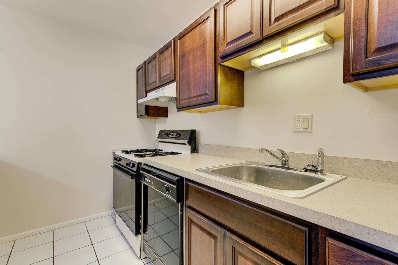 430 North Wilke Road, Unit 105 Palatine, IL 60074 - Photo 7 of 15 a kitchen with stainless steel appliances granite countertop a sink stove and cabinets