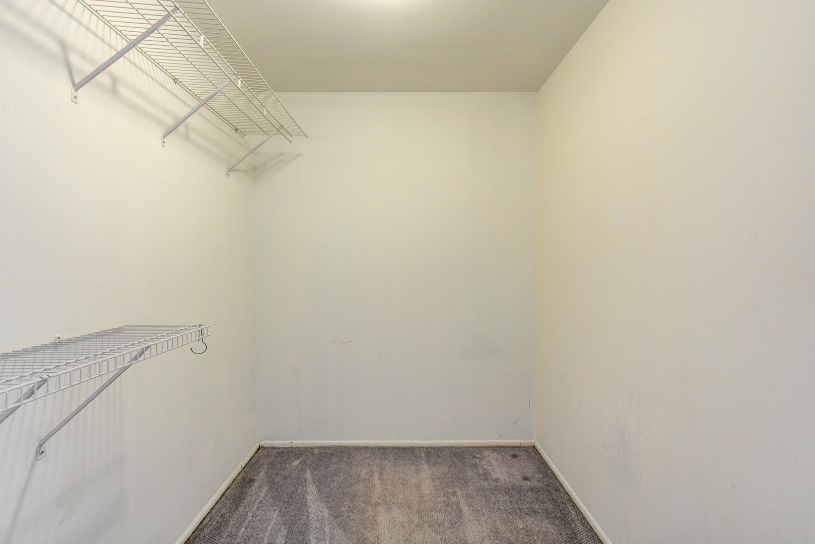 430 North Wilke Road, Unit 105 Palatine, IL 60074 - Photo 10 of 15 a view of a room with racks on the wall