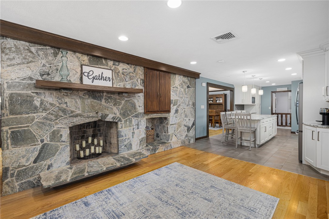 365 West Wrentham Road Cumberland, RI 02864 - Photo 14 of 50 Huge family room/den is located just off the kitchen and includes gorgeous stone fireplace.