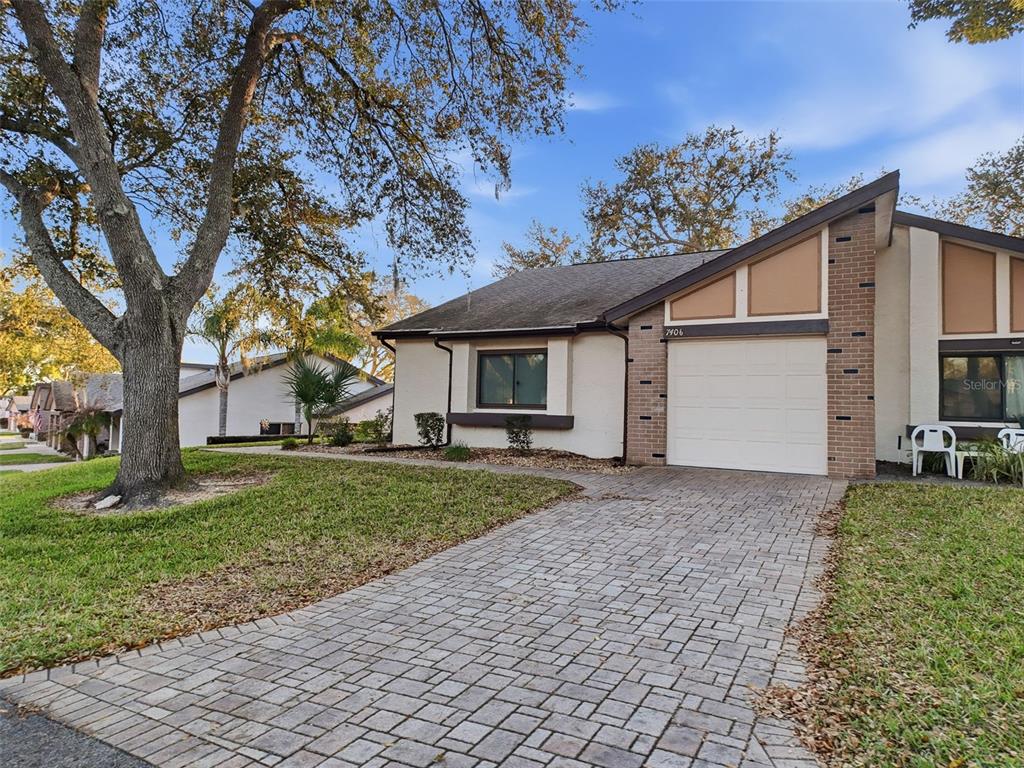 7406 Heather Walk Drive Weeki Wachee, FL 34613 - Photo 11 of 49 a view of a house with a garden