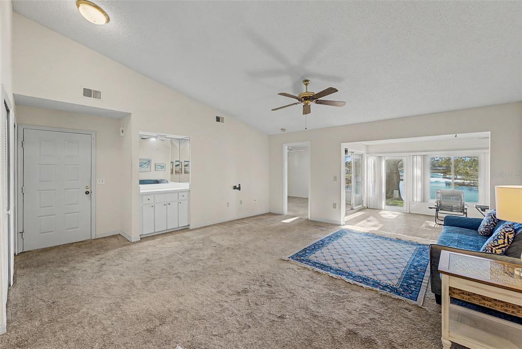 7406 Heather Walk Drive Weeki Wachee, FL 34613 - Photo 21 of 49 a large white bed in a white room