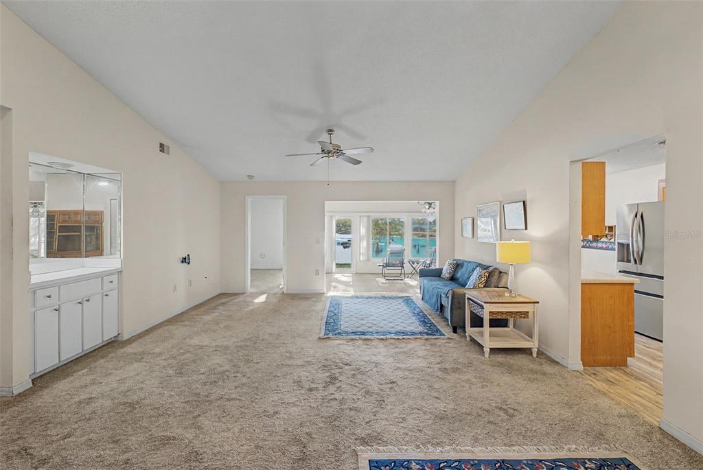 7406 Heather Walk Drive Weeki Wachee, FL 34613 - Photo 22 of 49 a living room with furniture and a large window